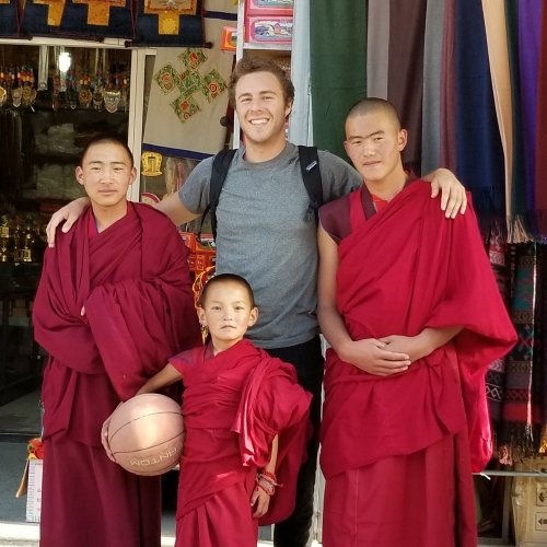 men stand together with basketball in tibet 